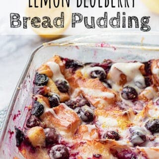 Baked Bread Pudding in glass pan wtih blueberries and lemon.