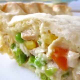 Easy Chicken Pot Pie is cheap, easy, and ready in under an hour. Filled with mixed veggies, creamy sauce, and a quick flaky pie crust!