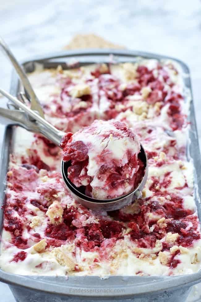 No Churn Cherry Cheesecake Ice Cream in a scoop on a pan. 