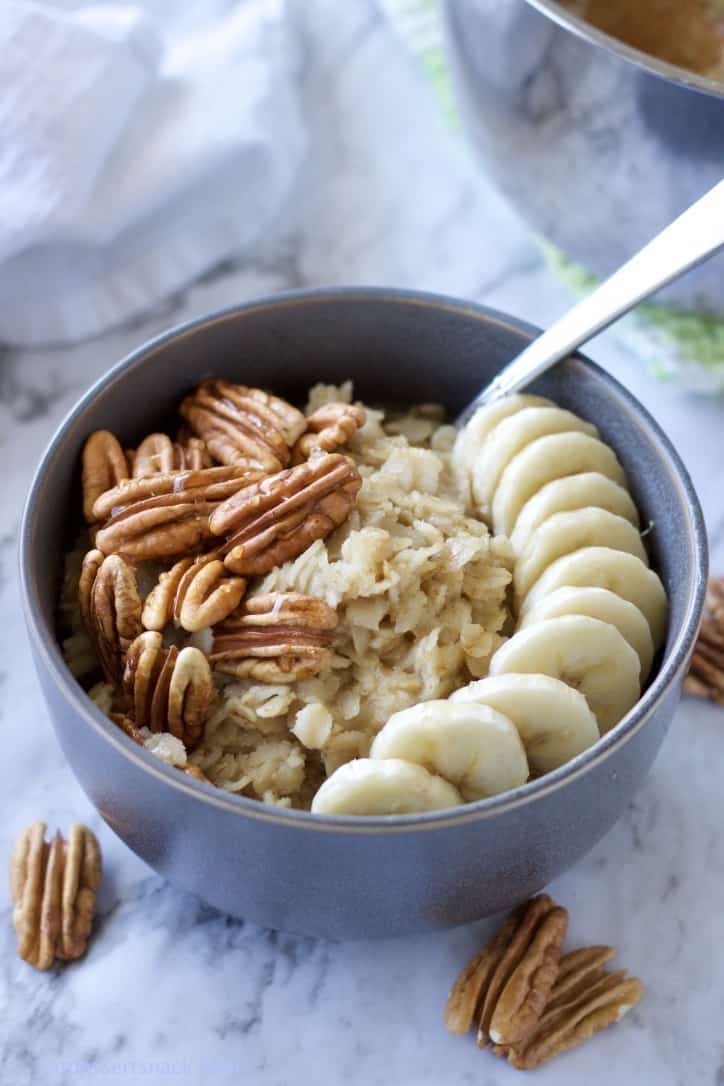 Banana Nut Oatmeal cooked in pot with pecans, bananas, and honey.