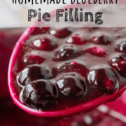 A spoonful of cooked blueberry pie filling.