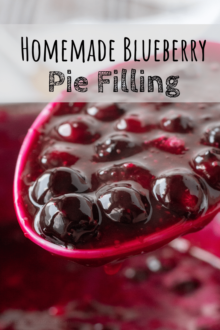 A spoonful of cooked blueberry pie filling.