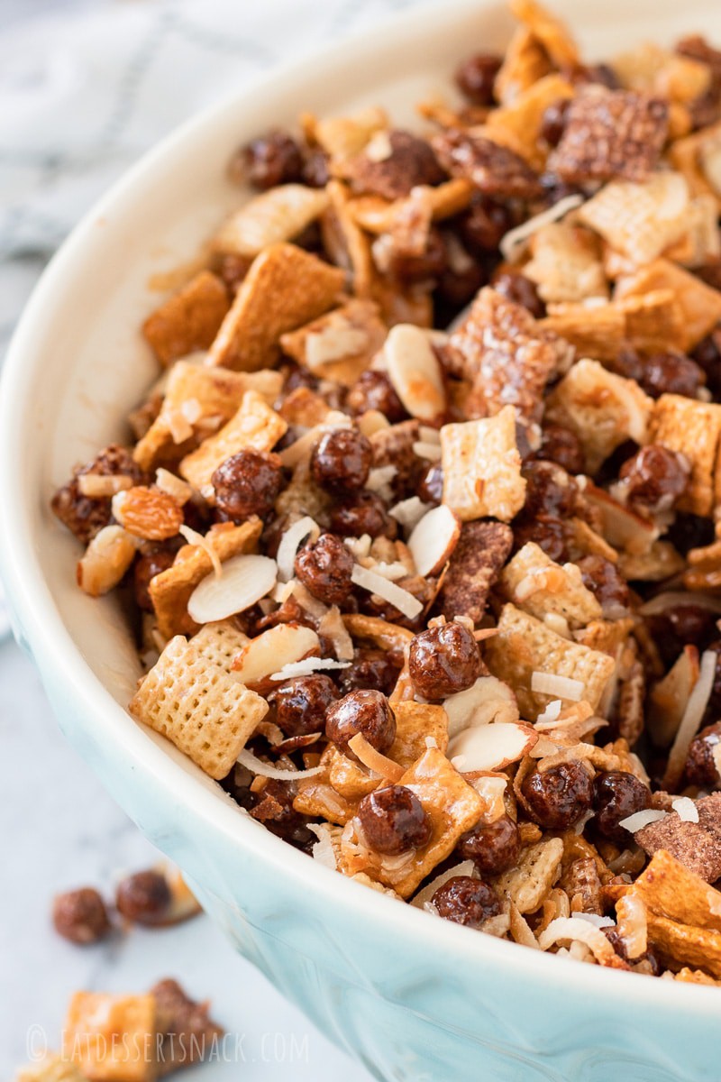 Blue bowl of chocolate gooey chex mix 