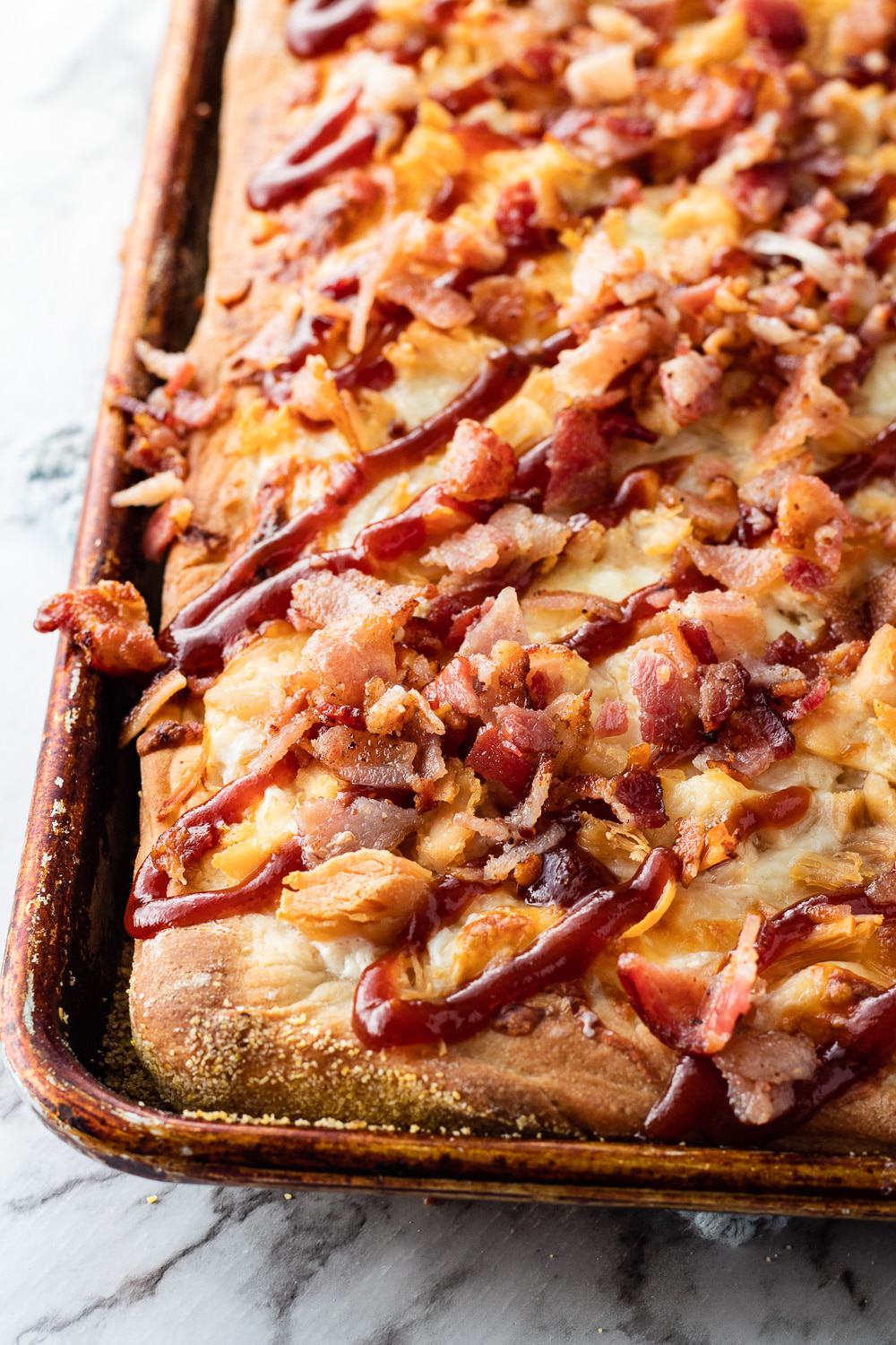 Baked Chicken Bacon Ranch sheet pan pizza in pan.