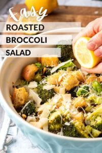 Cooked broccoli salad in blue bowl with lemon, text overlay reads "easy roasted broccoli salad".