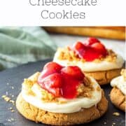 Baked Cherry Cheesecake cookies on black platter.