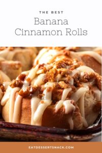 Frosted banana cinnamon rolls in metal pan with text overlay.