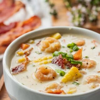 Cooked Shrimp Corn Chowder in white bowl.