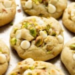 Baked pistachio pudding cookies on metal baking sheet.
