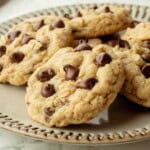 Baked sourdough oatmeal cookies on ceramic plate.