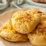 Baked chicken roll ups on white plate.