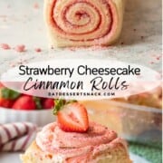 Raw strawberry cheesecake cinnamon roll on marble countertop and baked roll with sliced strawberry on white plate.