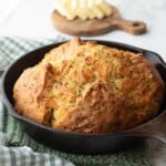 Baked cheese Irish soda bread in cast iron pan.