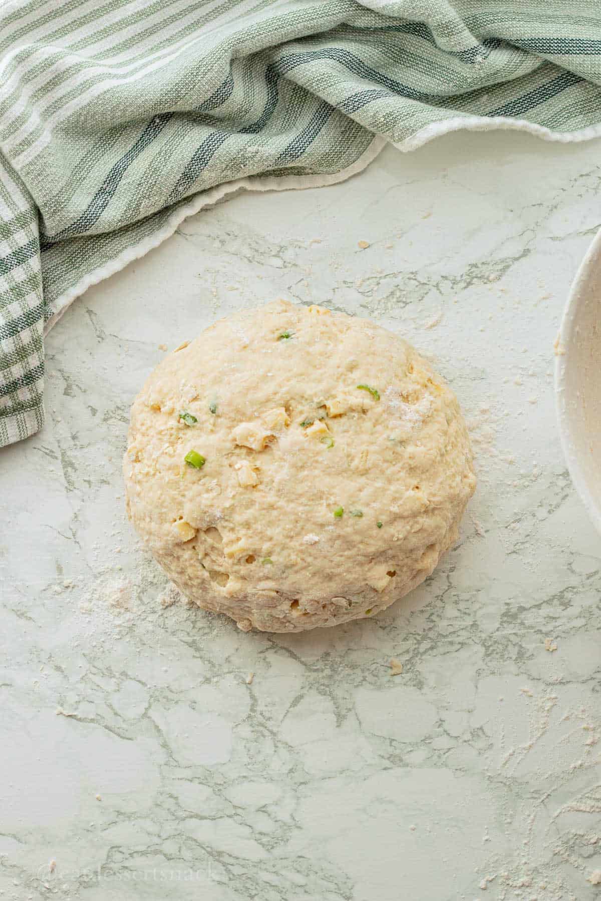 Ball of unbaked dough for cheddar irish soda bread.