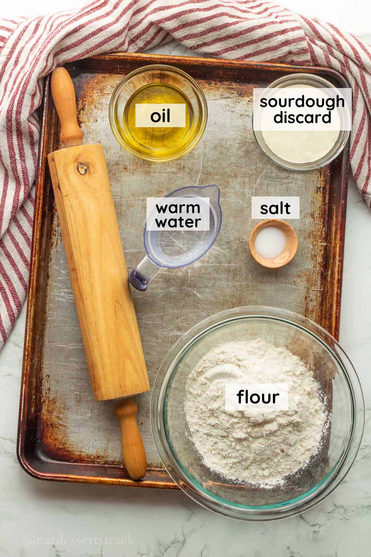 Ingredients for the dough on a baking sheet.