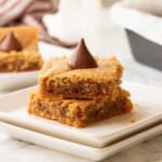 Peanut Butter blossom bar slices on plate.