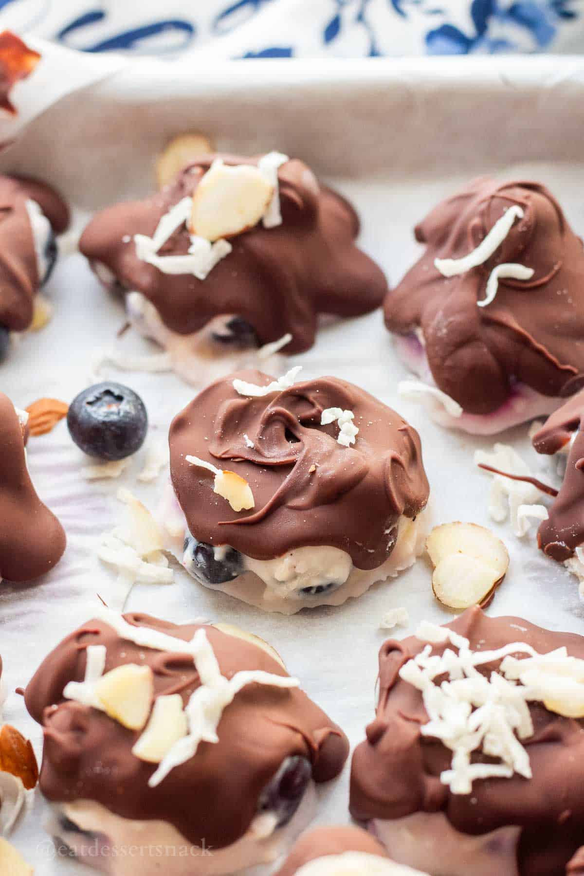Hardened chocolate on blueberry yogurt clusters.