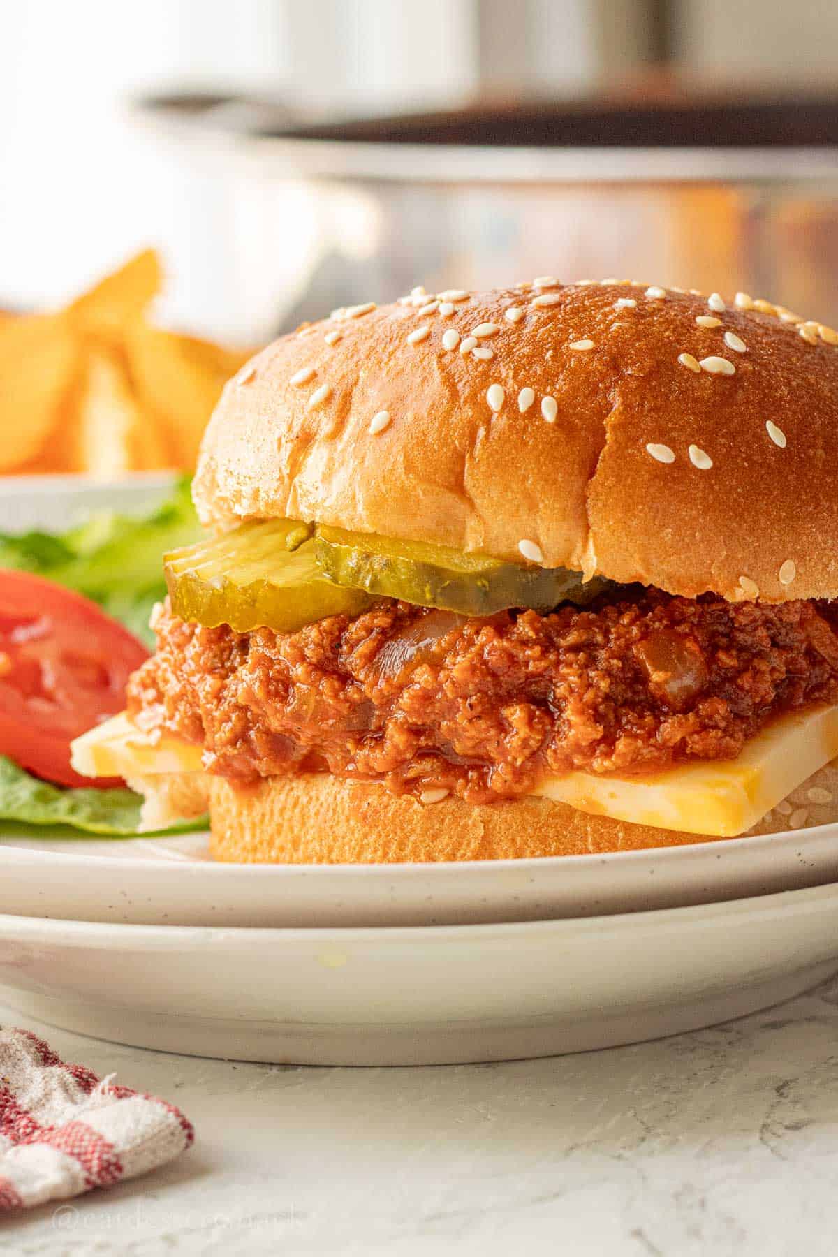 Cooked ground turkey sloppy joe sauce on hamburger bun.