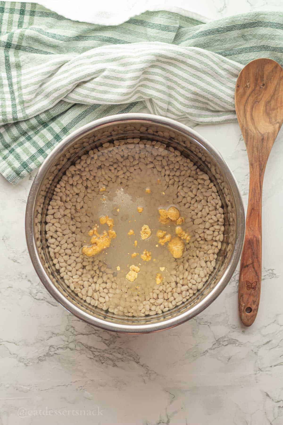 Uncooked beans with water and chicken bouillon.