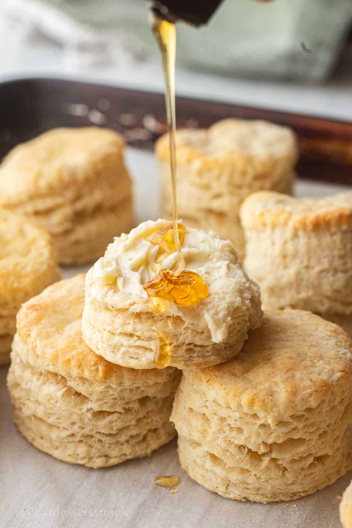 Drizzle honey on baked biscuit.