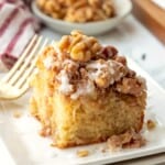 Baked banana coffee cake on plate with fork.