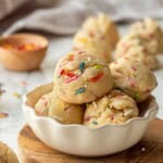 Scoops of edible sugar cookie dough in bowl with sprinkles.