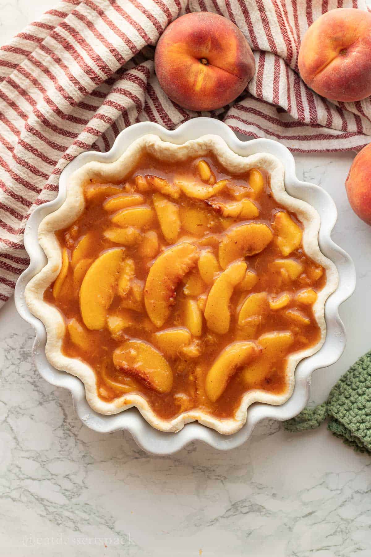 Peach pie filling in pie crust.