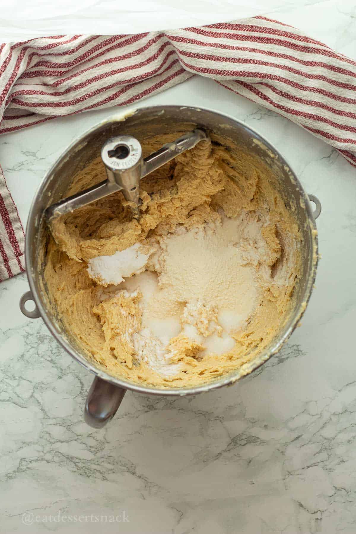 Vanilla pudding mix in cookie dough in mixing bowl.
