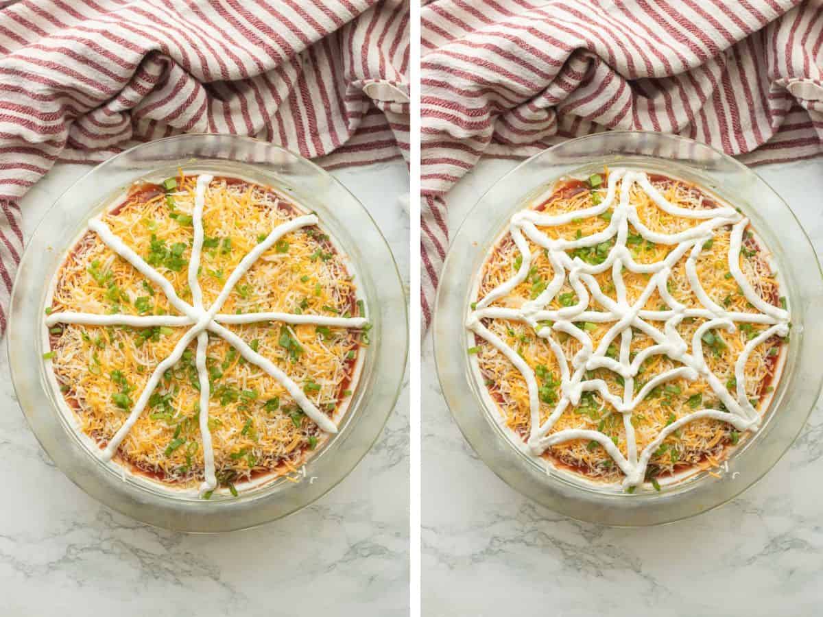 Sour cream in star shape on bean dip and sour cream in spider web shape in bean dip.
