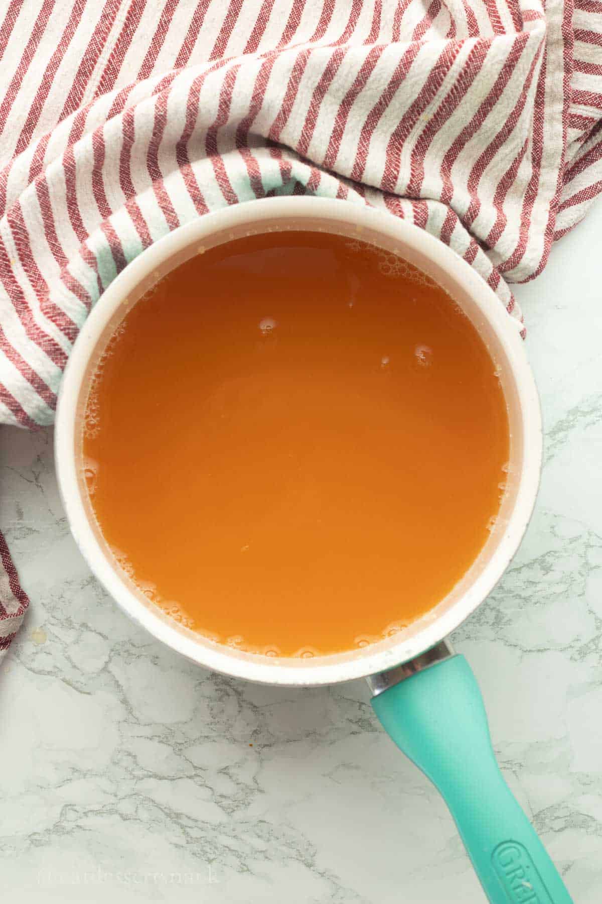 Apple cider in pan.