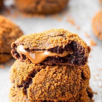 Baked biscoff filled chocolate cookie in half.