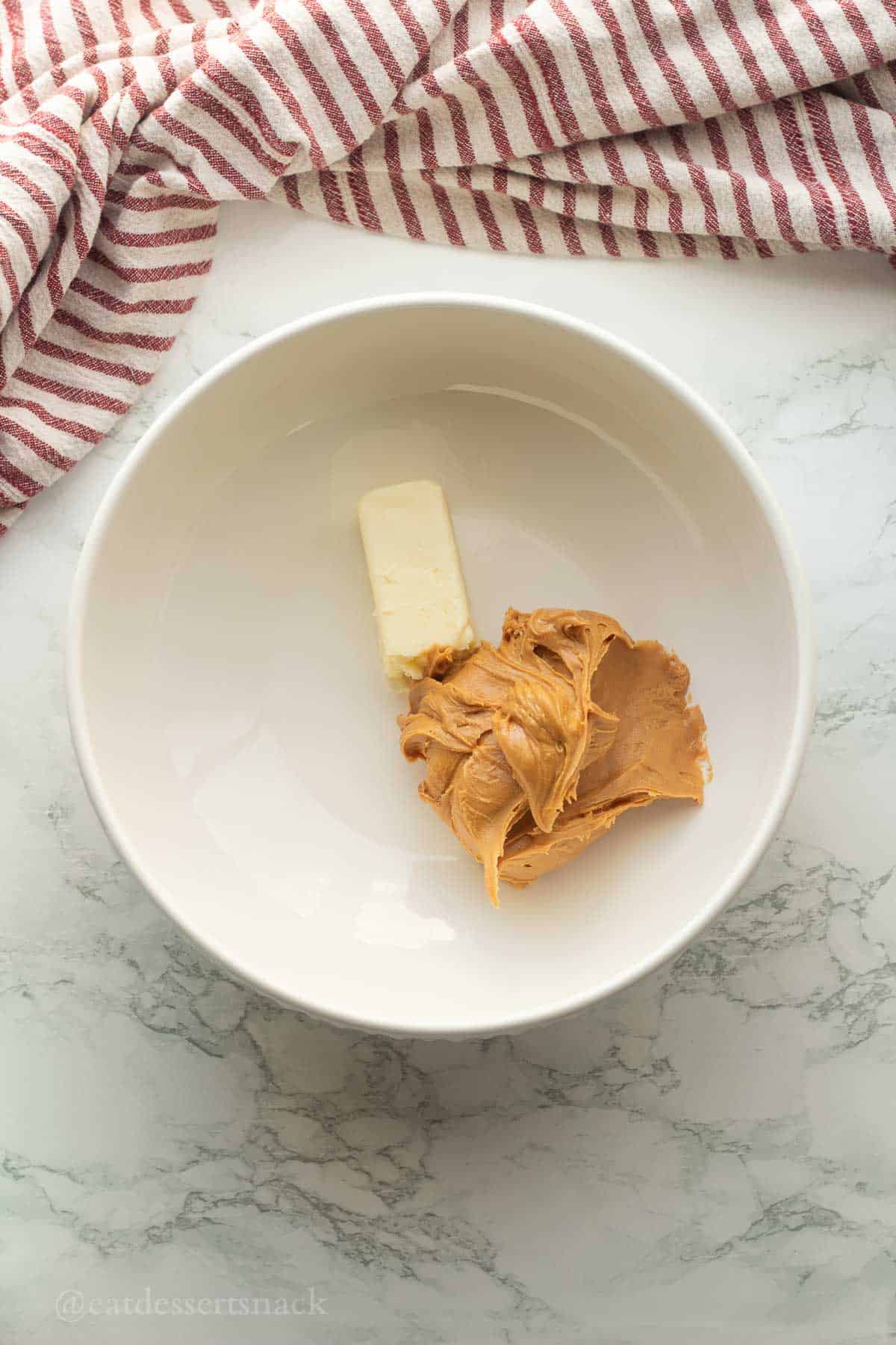 Butter and peanut butter in bowl.