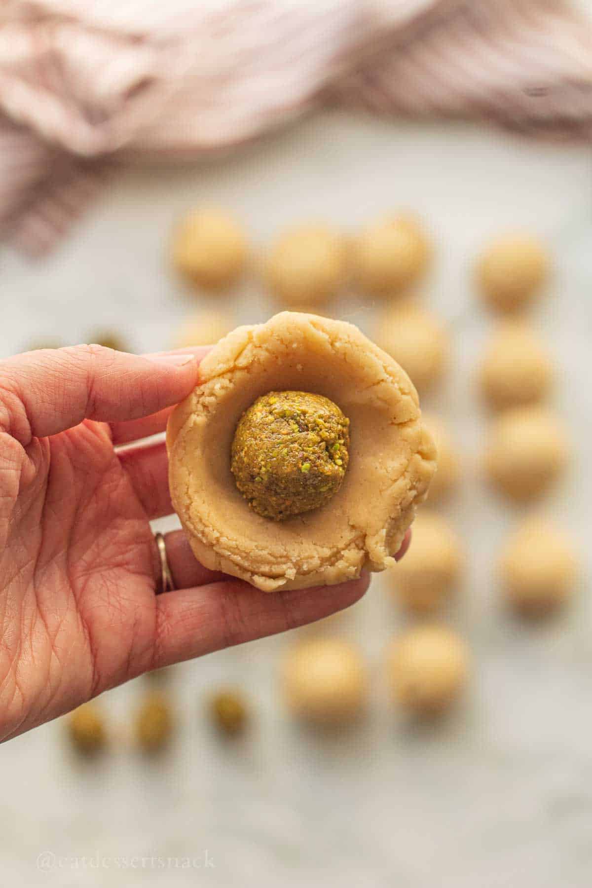Raw Cookie dough ball filled with baklava filling.