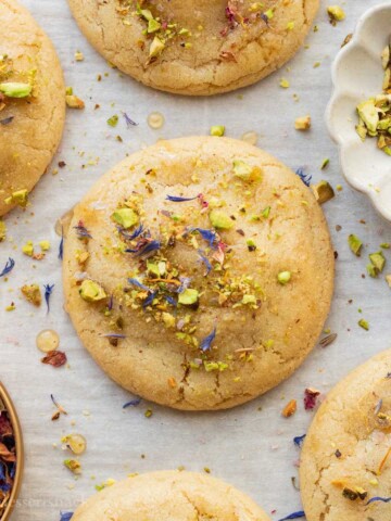 Baked baklava cookies on parchment paper.