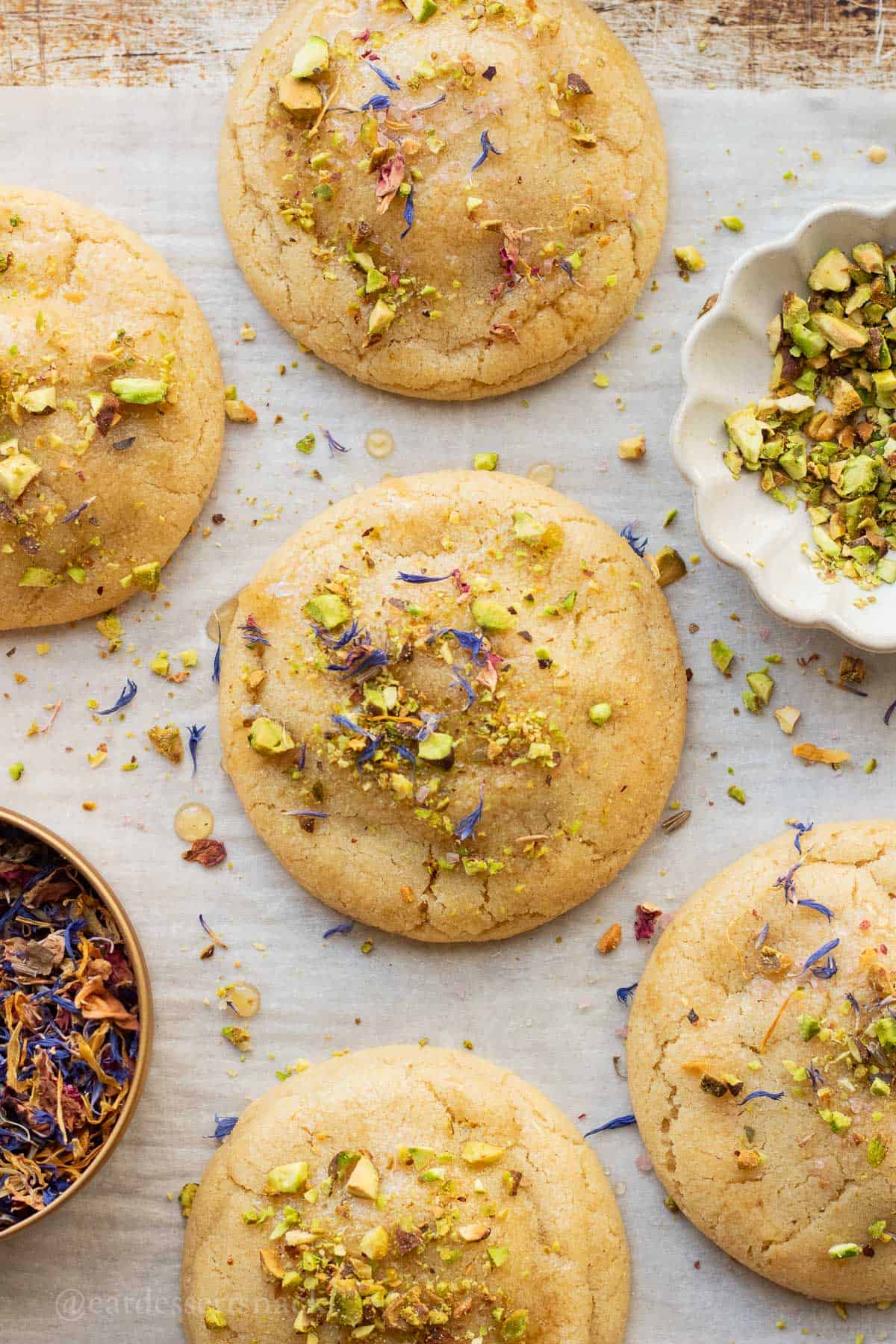 Baked baklava cookies on parchment paper.