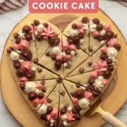 Heart cookie cake sliced with gold spatula.