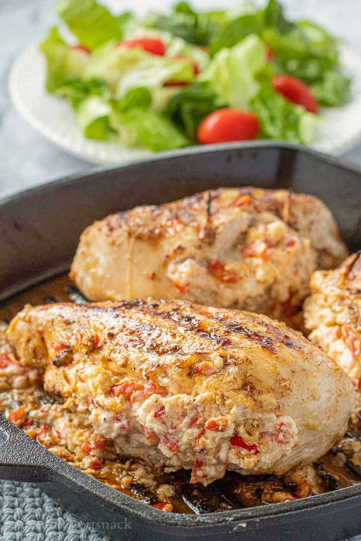 Cooked pepperjack chicken in frying pan.