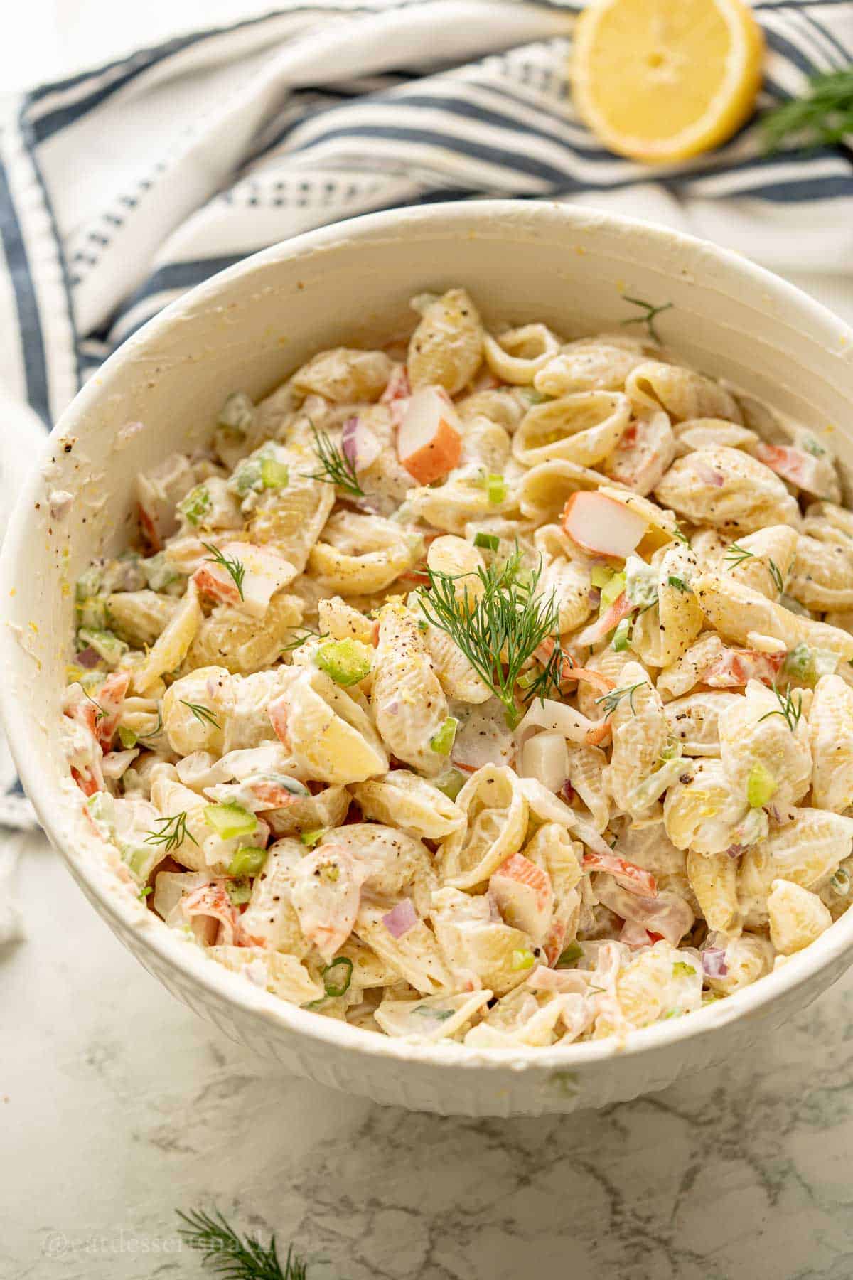 Creamy crab salad with dill on. Top.