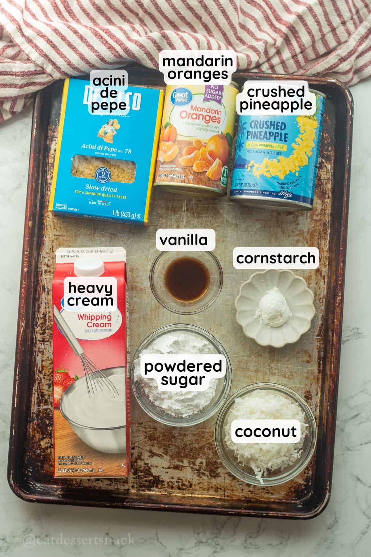 Labeled ingredients for frog eye salad on metal tray.
