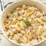 Creamy crab pasta salad with dill on top.