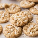 Baked coconut oatmeal cookies on pan.