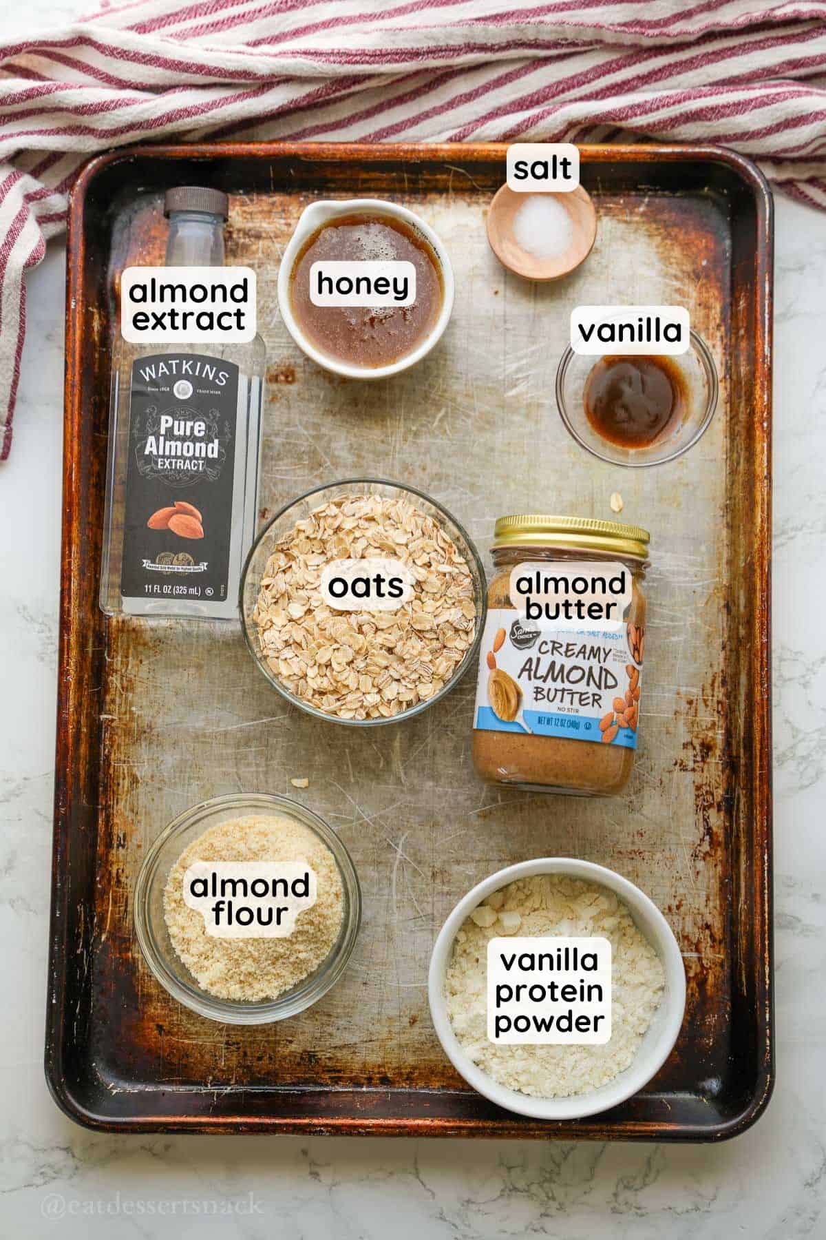 Labeled ingredients for almond butter protein balls.
