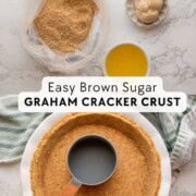 Smoothing graham cracker crust with cup and ingredients for crust.