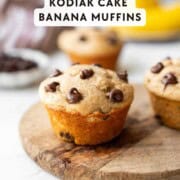 Baked banana protein muffin on cutting board.